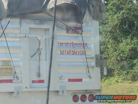 Rear of a trailer with the text 'I am not a Gynecologist, but I will take a Look'