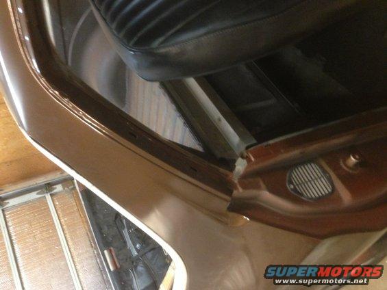 Brown interior door frame and black seat of a 1972 Ford Ranchero