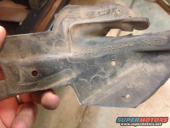 Part with Ford logo and part number DT-D20B-8520563-AD 1-2-L