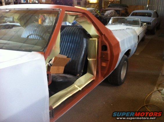 Interior of a 1972 Ford Ranchero with door open, undergoing bodywork