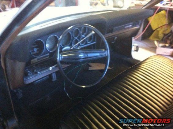 1972 Ford Ranchero interior with a large steering wheel and dashboard gauges