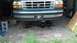1996 Ford F-150 - Front axle removed from a 1996 Ford F-150, parked in a garage.