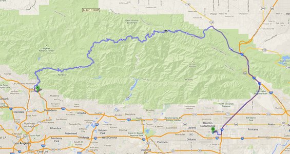 Map showing a route through mountains and urban areas, with GPS coordinates visible