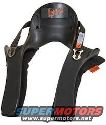 Black HANS device with orange and white tags, "HANS" logo visible