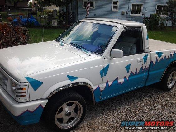 1986 Mazda B2000 pickup truck with custom white and blue graphics on the side
