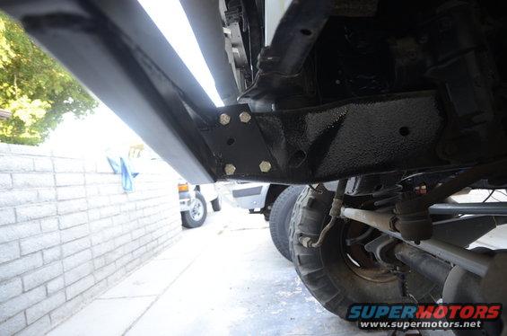 Underside of a 1979 Ford Bronco showing running boards, frame, and tires