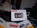 1990 Ford Bronco - Kodak EasyShare R4530 digital camera box and accessories are laid out on a bed.