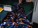 1990 Ford Bronco - A person is seen wearing blue pajamas with a Scooby-Doo theme while relaxing on a bed.