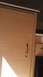 2000 Ford F-250 - Close-up view of a wooden cabinet door and drawer inside a camper.