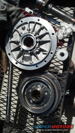 Transmission pump housing and planetary gear set on a metal grate