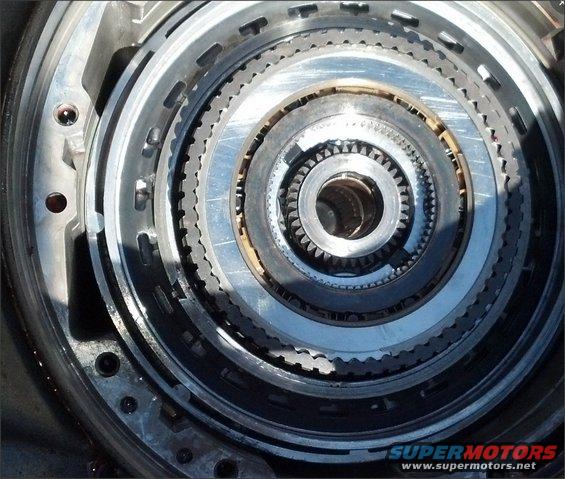 Close-up of E4OD transmission internal components, showing stacked clutch packs and gears