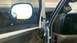 1997 Dodge 3500 - The interior of a truck shows exposed door panel components and a gauge mounted on the dashboard.