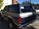 1986 Ford Bronco - Rear view of a 1986 Ford Bronco with a '990' decal on the rear window.