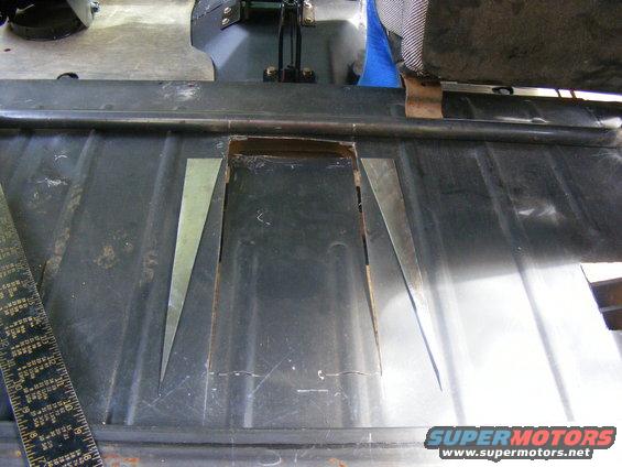 Interior floor panel with cutouts and metal inserts, ruler visible