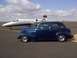 1939 Chevrolet Biscayne - A blue 1939 Chevrolet sedan is parked on an airport tarmac next to a private jet.