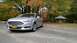 2013 Ford Fusion - Silver 2013 Ford Fusion parked outdoors during autumn with colorful foliage.