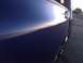1939 Chevrolet Biscayne - Close-up of a car's side panel and mirror with sunset reflection. Supermotors.net logo is present.