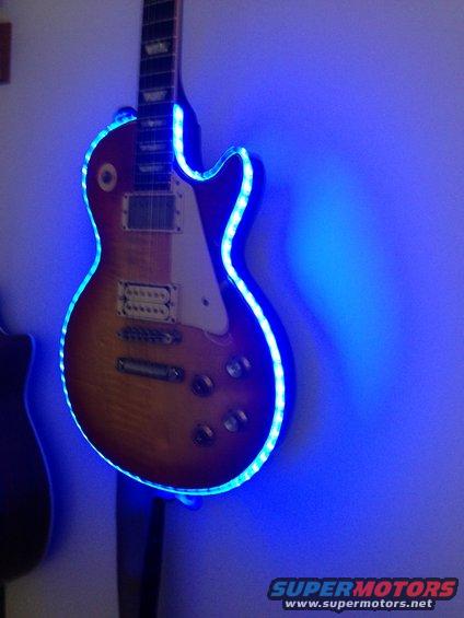 Electric guitar with blue LED lights, angled view