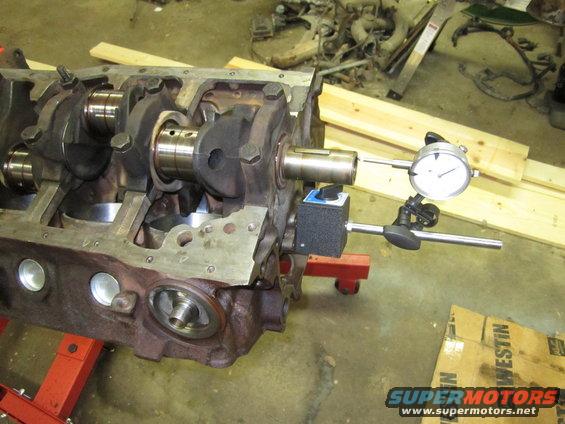 Engine block with crankshaft and dial indicator measuring runout