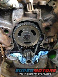 Timing chain cover with Supermotors logo visible