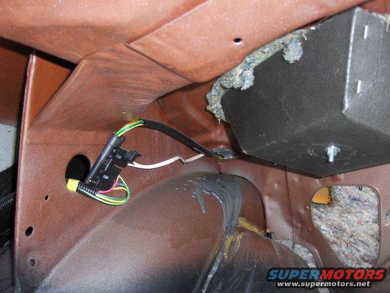 close-up of wiring harness and insulation in a car's interior