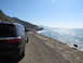 2012 Dodge Durango - A Dodge Durango is parked on a coastal road with the ocean to the right.