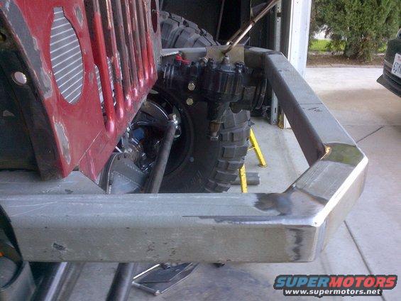 1985 Jeep CJ7 front end with custom steel bumper and red grille