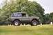 1976 Ford Bronco - Side view of a 1976 Ford Bronco in a cemetery setting.