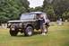 1976 Ford Bronco - Man poses with a 1976 Ford Bronco in a cemetery setting.