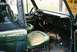 1976 Ford Bronco - Interior view of a 1976 Ford Bronco, highlighting its green seats and dashboard details.