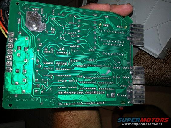 Green circuit board with visible text 'UTA 601-0485-001 REVP 401 3-15'