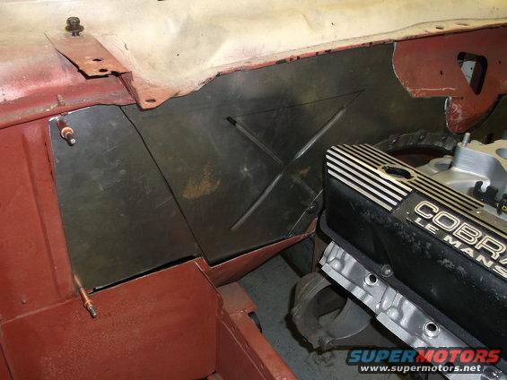Engine bay firewall with "COBRA LE MANS" valve cover visible