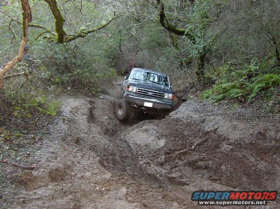 hollister-036.jpg dan was doing good until here. then as best i can guess, he lost a hub. then while he was backing down, the drivers rear tire lost the bead. 

1 wheel drive bronco + muddy ruts = not fun