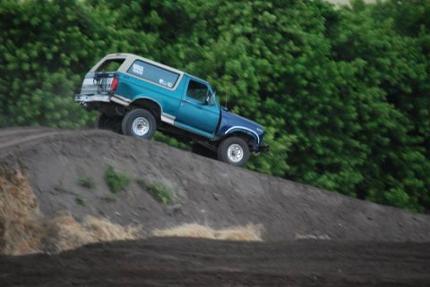1996 Ford Bronco - This 1996 Ford Bronco is shown climbing a steep dirt incline.