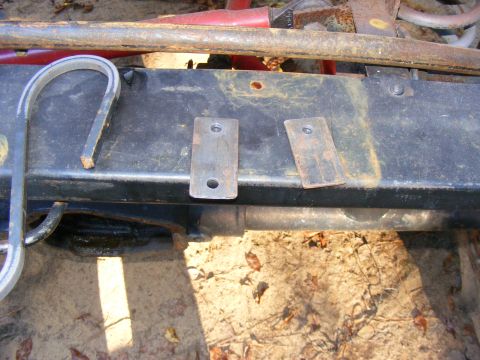 Close-up of frame with two metal plates attached