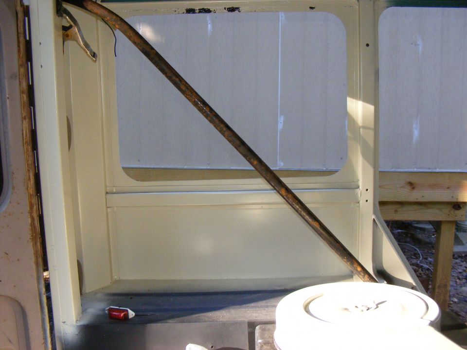 Interior view of a vehicle with a diagonal bar and windows