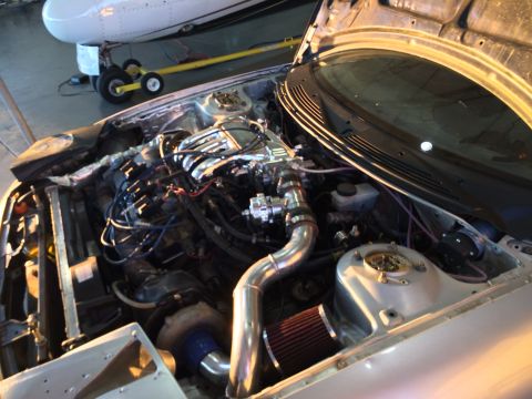 1995 Ford Probe - The engine bay shows a custom turbo setup with aftermarket parts and piping.