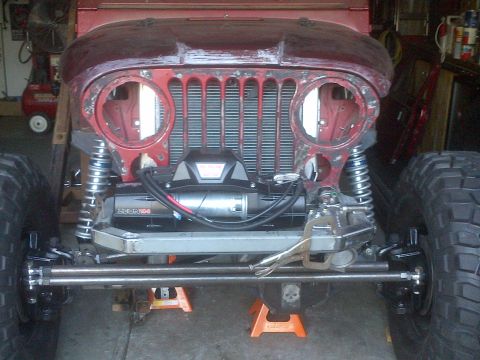 1985 Jeep CJ7 - Front view of a 1985 Jeep CJ7 project vehicle with its grille and winch visible.