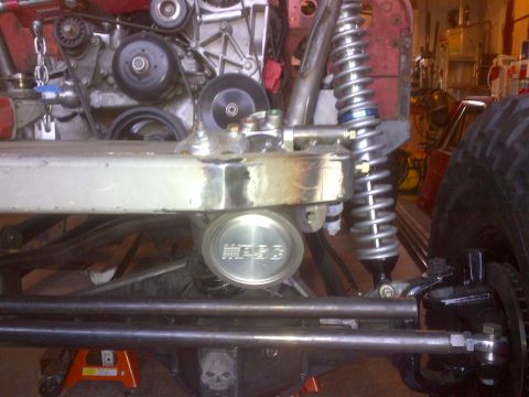 1985 Jeep CJ7 - Custom Jeep CJ front suspension and engine bay details, including a WARN hub cap.