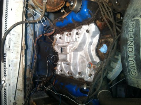 1979 Ford Bronco - Close-up view of an engine bay, showing the intake manifold and surrounding components.