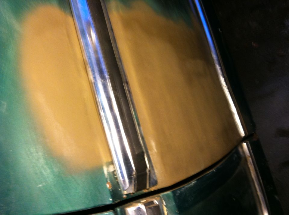 Hood detail with primer and chrome trim