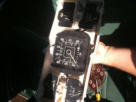 1978 Ford Bronco - Instrument cluster removed from a 1978 Ford Bronco, showing gauges and wiring.