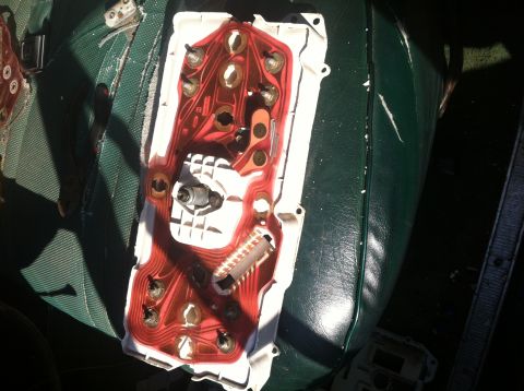 1978 Ford Bronco - The back of a vehicle's instrument cluster is shown, revealing its internal wiring and circuit board.