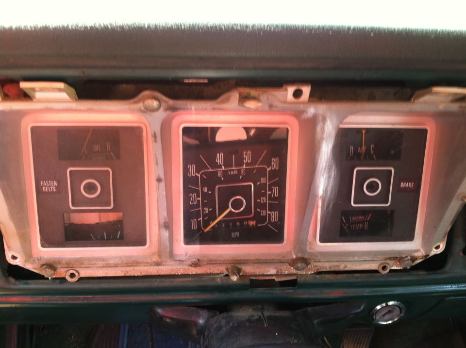 Dashboard with speedometer, fuel gauge, oil pressure gauge, and brake warning light