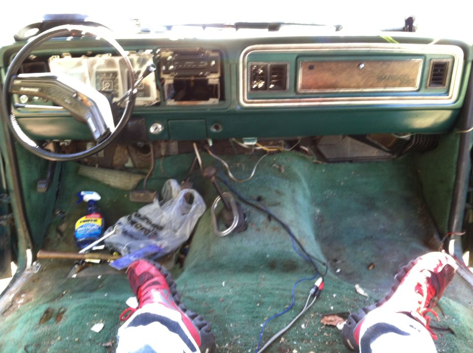 1978 Ford Bronco interior showing green carpet, dashboard, and steering wheel