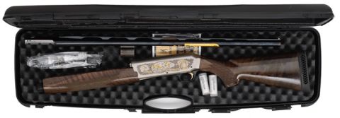1990 Ford Bronco - A shotgun and its components are neatly arranged inside a protective carrying case.