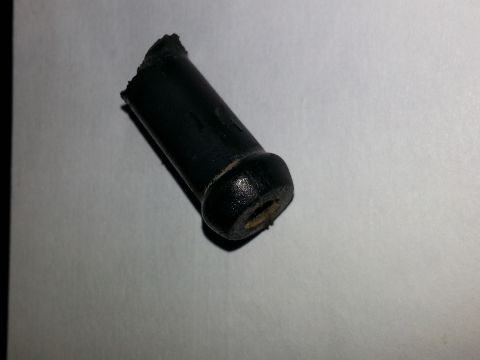 1994 Ford Bronco - A damaged black rubber component, possibly a grommet or bushing, is shown against a neutral background.