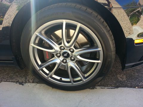 2013 Ford Mustang - Close-up of a car's wheel, showing the tire and rim detail.