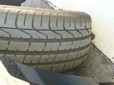 2013 Ford Mustang - Tire tread detail, showing the pattern and wear.