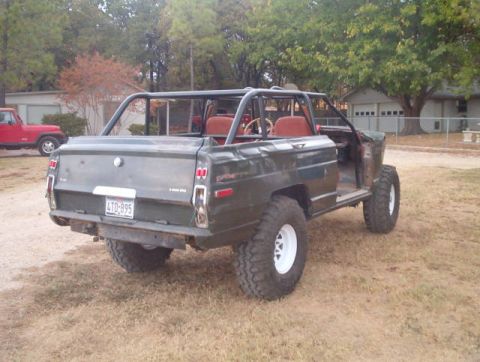 1982 Jeep Wagoneer - This 1982 Jeep Wagoneer has been modified for off-road use with a prominent roll cage and large tires.